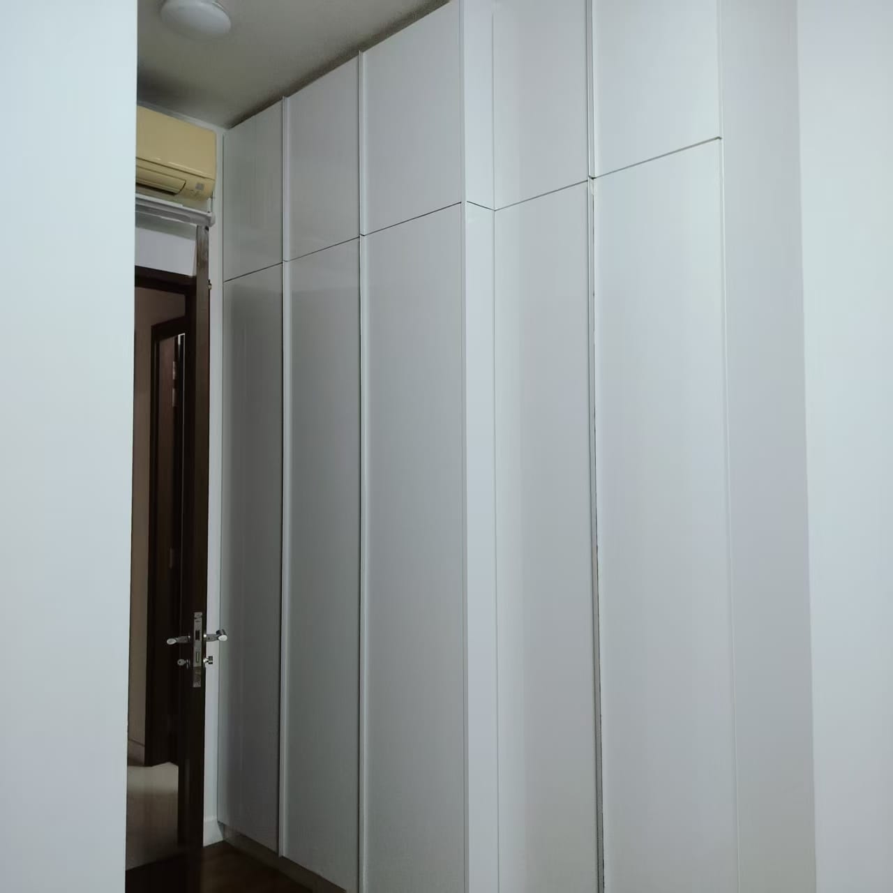 White wardrobe after professional refurbishment in Singapore